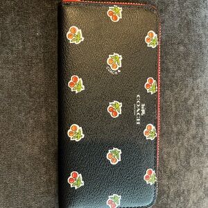 Vintage, never been used coach wallet. In perfect condition.